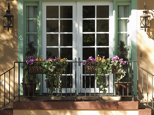 Front door of a home with potted plants in Longmont, Colorado